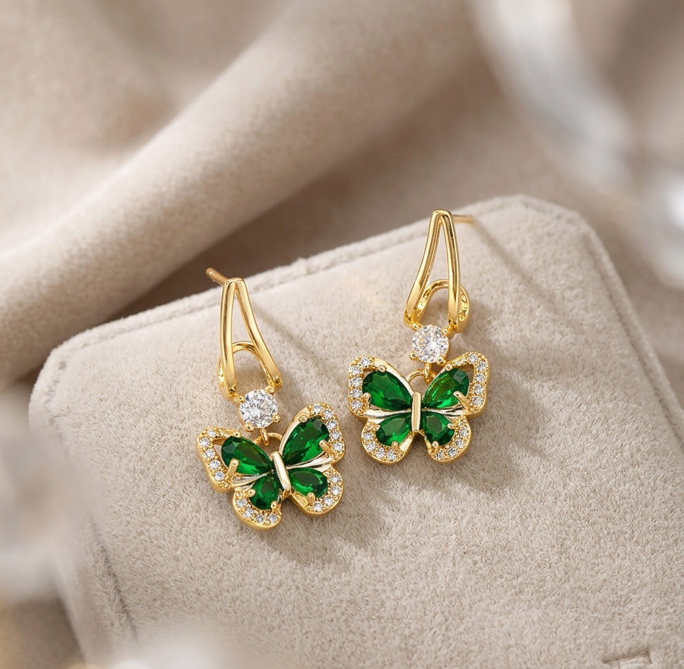 Elegant Gold Butterfly Earrings with Emerald Green Stones