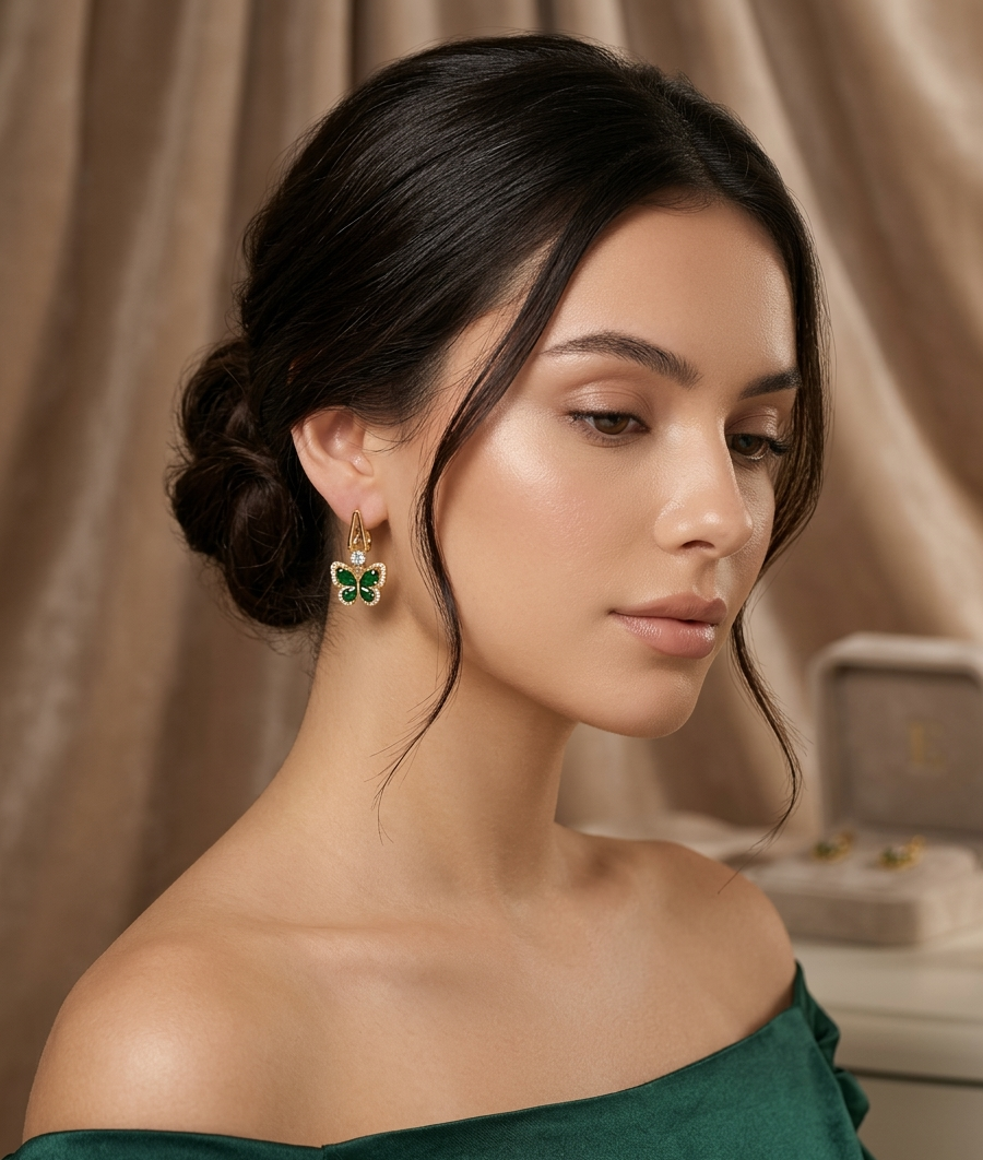 Elegant Gold Butterfly Earrings with Emerald Green Stones