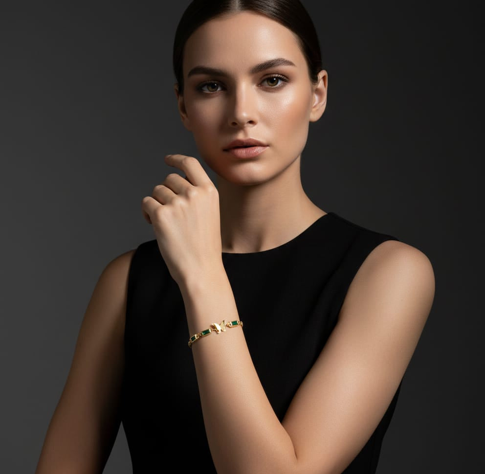 Elegant Gold Butterfly Bracelet with Emerald Accents
