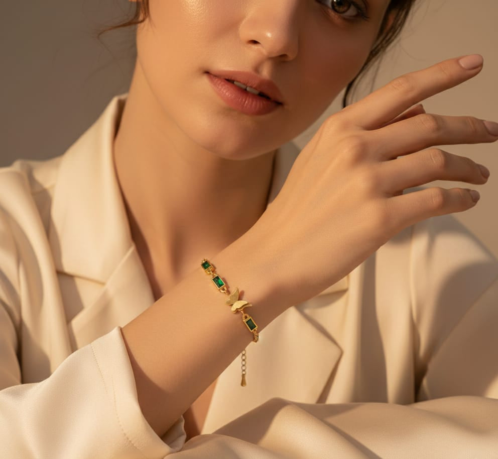 Elegant Gold Butterfly Bracelet with Emerald Accents